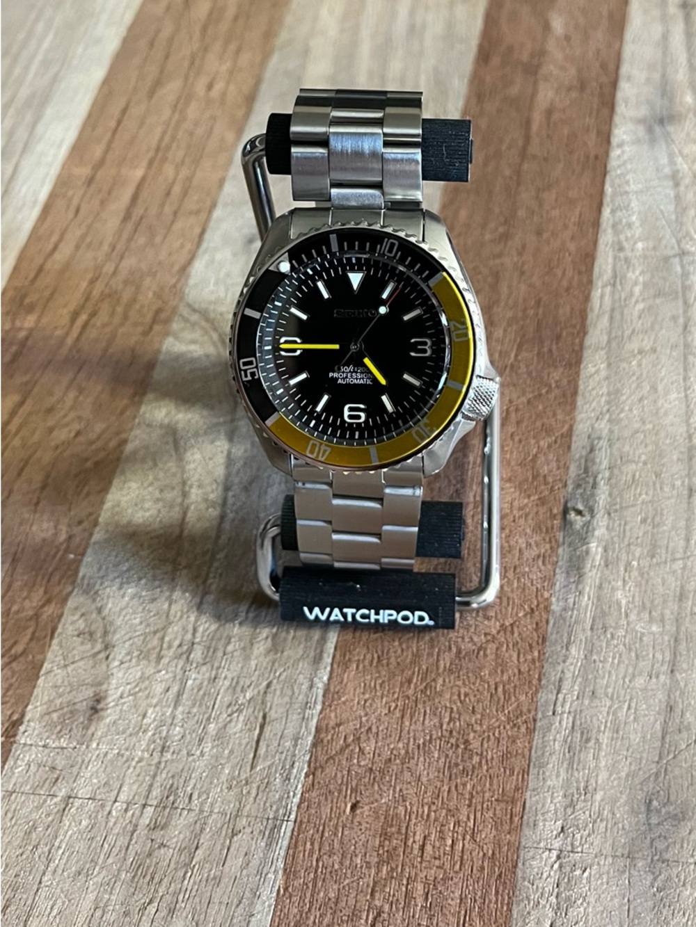 Stainless Steel Watch with Black Dial and Yellow Accent